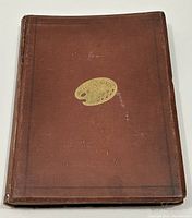 Front cover of brown cloth with gilt palette motif