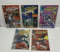 Five issues of The Amazing Spider-Man comics including issues 285 to 289 displayed upright, bagged and boarded, showing front covers.