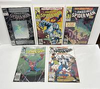 Front view of all 5 Amazing Spider-Man issues arranged in two rows showing covers, including one with hologram cover