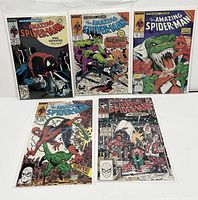 Five Amazing Spider-Man comics #308, #312, #313, #314, and #318 displayed bagged and boarded with clear view of cover art.
