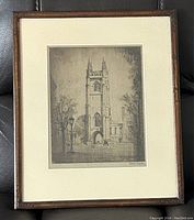 Framed etching with cream mat and dark wood frame showing entire artwork and frame.
