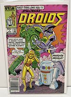 Front cover of Star Wars Droids #1 comic book showing droids C-3PO and R2-D2 fighting metal monsters with speech bubbles, bagged and boarded.