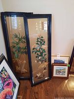 Group photo of four Asian style framed panels with glass, showing floral, bamboo, and bird designs, with some scratches visible on frames.