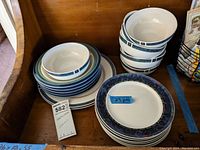 Full view of stacked cereal bowls, salad plates and dinner plates of the Pfaltzgraff Atalya dish set arranged for display.