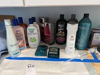 Full view of hair care bottles and boxed soaps on counter