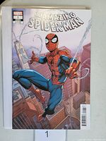 Front cover image showing Spider-Man swinging over city buildings, Marvel logo and comic issue details.