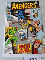 Front cover of Avengers #74 comic book featuring Marvel superheroes Vision, Black Panther, Wolverine, and Captain America with 'Death is the Hunter!' tagline.