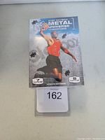 Front photo of sealed 2021 Skybox Metal Universe Champions blaster box with athlete image and pack quantity details.