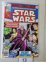 Front cover of Star Wars #24 comic book showing Obi-Wan Kenobi, C-3PO, and other characters with lightsabers.