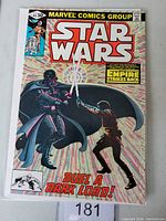 Front cover of Star Wars #44 Marvel comic book showing Darth Vader and Luke Skywalker in lightsaber duel.