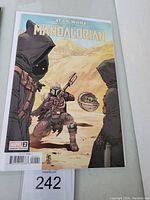 Front cover of The Mandalorian #2 Variant Marvel comic book showing the Mandalorian, Jawas, and Grogu in a desert setting.