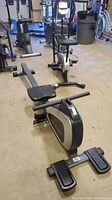 Front side view of full rowing machine in storage area