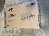 Box of DHP FI330BLKS metal futon frame closed showing branding and model number.