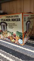 Original packaging of the Healthcraft Stainless Steel Steamer Juicer set showing product features and usage visuals.