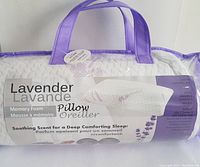 Pillow in packaging showing lavender scent claim and memory foam detail.