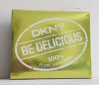 Front of the box showing branding 'DKNY Be Delicious 100% Pure New York' in gold and white color.