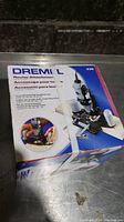 Box of a Dremel Router Attachment 330 showing product name and image of attachment on rotary tool.