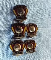 Five vintage sterling silver baseball pins by Birks, showing years 1946, two 1947 pins, 1948, and 1949 with St. Clements inscription in red and gold enamel on a shield shape.