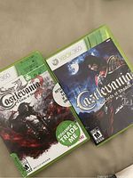 Photo of two Xbox 360 games: Castlevania Lords of Shadow and Castlevania Lords of Shadow 2 in original cases.
