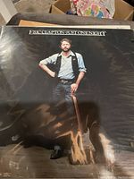 Eric Clapton Just One Night vinyl LP cover with Eric Clapton holding guitar