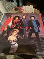 Photo of a vinyl album cover featuring the band Heart with the title clearly visible and band members shown in distinctive 80s style clothing.