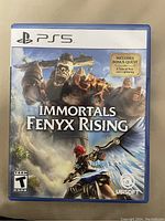 Front cover of Immortals Fenyx Rising PS5 game case showing game artwork and bonus quest sticker.