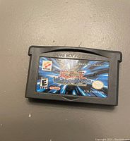 Game Boy Advance cartridge labeled Yu-Gi-Oh! World Championship Tournament 2004 by Konami