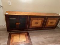 Front view of full cabinet with detached panel sections on floor