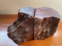 Pair of vintage redwood burl bookends shown from side with natural bark texture and smooth polished flat ends against a plain background.