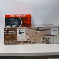 Photo of two ceiling fan boxes, front and side views, showing 56" wood ceiling fan with light box and a smaller black and red box labeled 'Ceiling Fan with Light' with a graphic of fan blades.