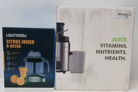 Photo showing two boxed juicers: Luukmonde Citrus Juicer D-8020A and Juice Power Juicer