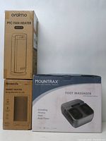 Image showing three boxed items including Oraimo PTC fan heater, GoveeLife Smart Heater, and Mountrax Foot Massager, confirming the main items offered.