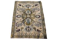 Full view of Persian Ardabil backrest rug showing central medallion and border design.