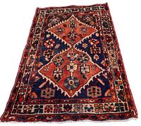 Full view of the Persian Bakhtiar rug spread out on a solid background showing the entire design with two central medallions and border patterns.