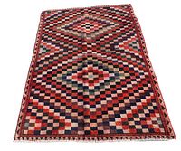 Full view of Persian Gabeh rug with checkerboard pattern arranged flat on white background.