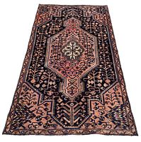 Top-down view of full rug on white background showing overall pattern and wear