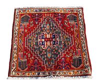 Full view of a square Persian Shiraz tribal rug, showcasing central medallion and surrounding geometric patterns with colorful natural dyes.