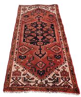 Full flat lay of rug showing entire geometric pattern and border.