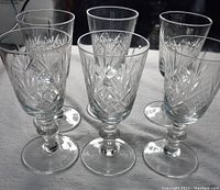 Set of six small Edinburgh Crystal glasses arranged together, showing overall shape and size.
