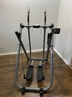 Front-facing photo of full Tony Little Gazelle exercise machine showing foot pedals and handlebars