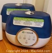 Photo of the top blue and white design of one humidifier showing the stainless steel knob and opening