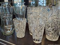 Vases and decorative bowls in various designs, clear crystal and glass with cut patterns