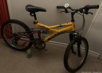 Full view of yellow 20" Supercycle Mercalli bicycle with knobby tires, rear and front suspension, handlebars, and adjustable seat.