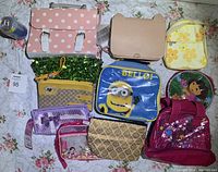Photo displaying all 10 bags and pouches including satchel, crossbody, backpacks, and various themed pouches.
