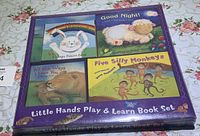 Complete set of four children’s books in original packaging titled 'Little Hands Play & Learn Book Set' including illustrated front covers of each book.