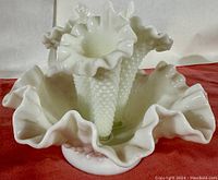 Front and side view of the vintage Fenton epergne showing three removable trumpet-style horns and ruffled bowl base in hobnail milk glass.
