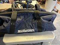 Mastercraft blue and black carrying bag with branded logo on front.