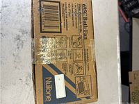 Original box packaging showing NuTone branding and product model 695C with features listed such as 70 CFM airflow and white polymeric grille.