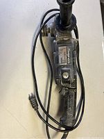 Another Snap-On power tool, angle grinder or sander, with trigger handle and power cord in used condition.