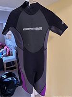 Front view of Body Glove women's wetsuit showing logo, color scheme, and style.